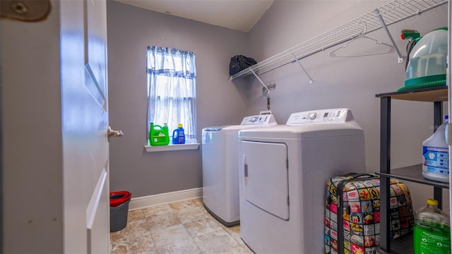 laundry room with washing machine and clothes dryer