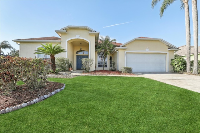 view of front of property with a garage and a front yard