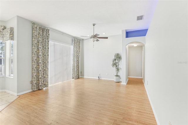 unfurnished room featuring light wood-type flooring and ceiling fan