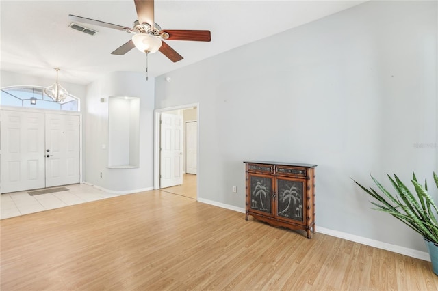 entrance foyer with ceiling fan and light hardwood / wood-style flooring