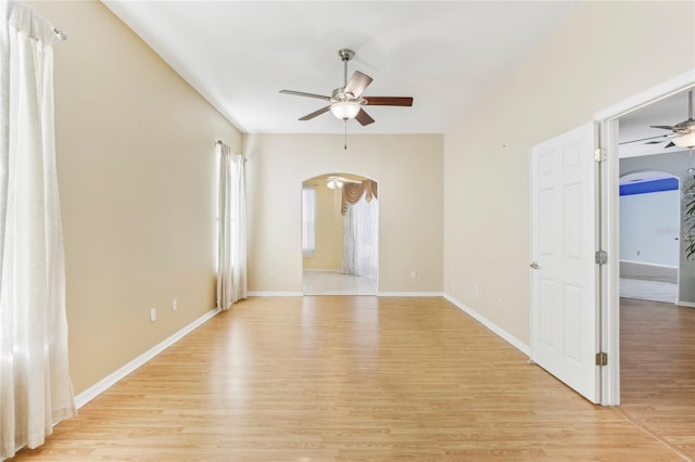 spare room featuring ceiling fan and light hardwood / wood-style flooring