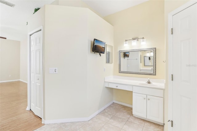 bathroom featuring hardwood / wood-style floors and vanity