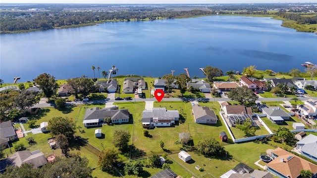 birds eye view of property with a water view