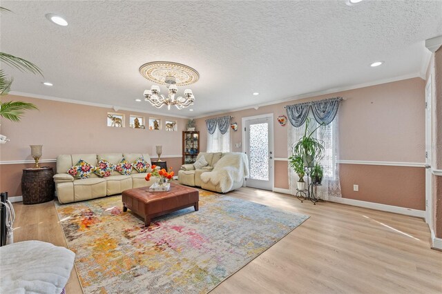 1395 Emerald Dr, Kissimmee, FL 34744 - living room with recessed lighting, a chandelier, crown molding, baseboards, and wood finished floors