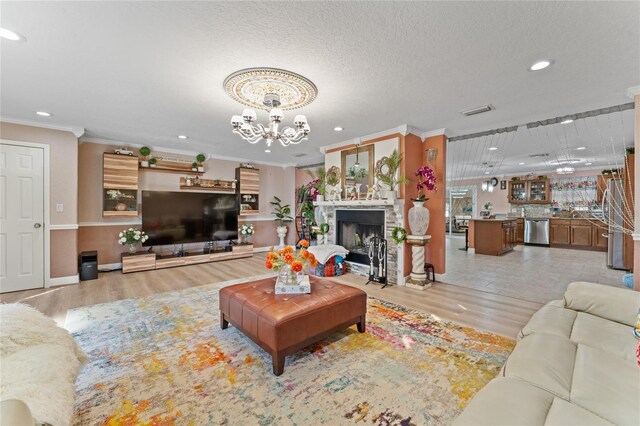 1395 Emerald Dr, Kissimmee, FL 34744 - living room with a chandelier, crown molding, light wood-style flooring, recessed lighting, and baseboards
