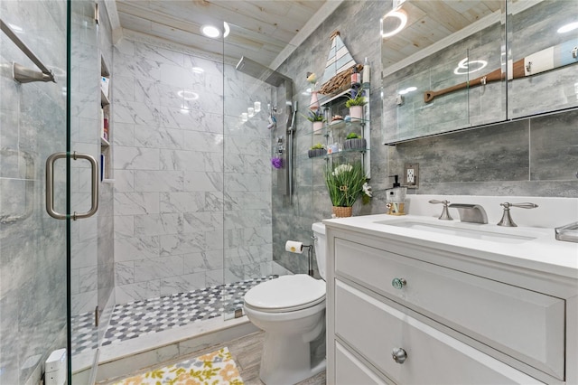 bathroom featuring a shower with door, hardwood / wood-style flooring, tile walls, toilet, and vanity