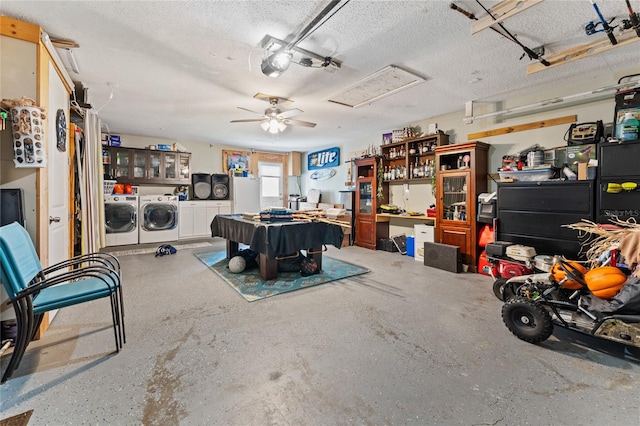 garage featuring white refrigerator, washer and dryer, and ceiling fan