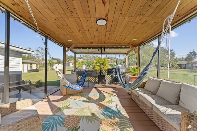 unfurnished sunroom with wood ceiling