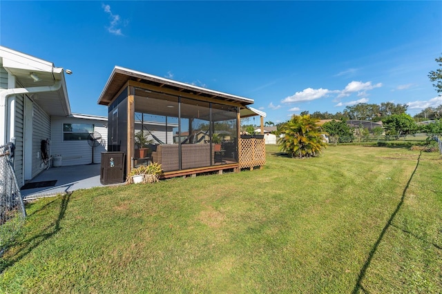 view of yard with a sunroom