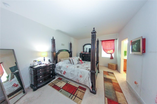 carpeted bedroom featuring multiple windows