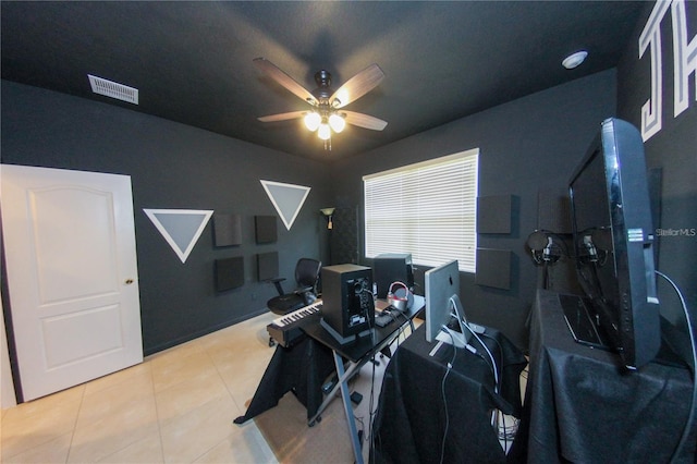 interior space featuring light tile patterned flooring and ceiling fan