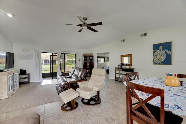 tiled living room featuring lofted ceiling and ceiling fan