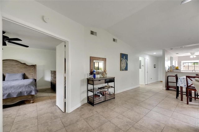 interior space with vaulted ceiling and ceiling fan