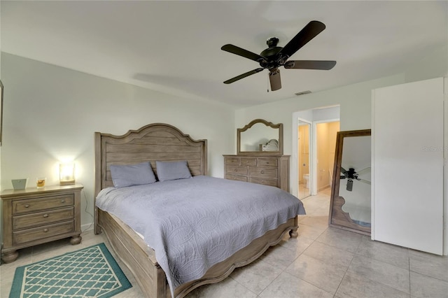 tiled bedroom featuring ceiling fan