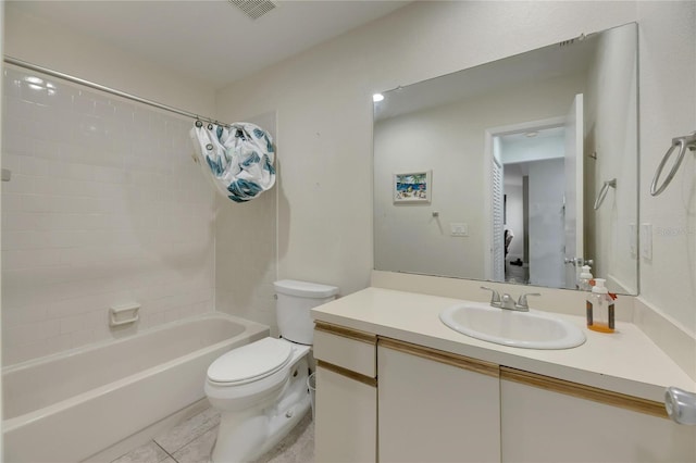 full bathroom featuring vanity, tile patterned flooring, toilet, and shower / tub combo