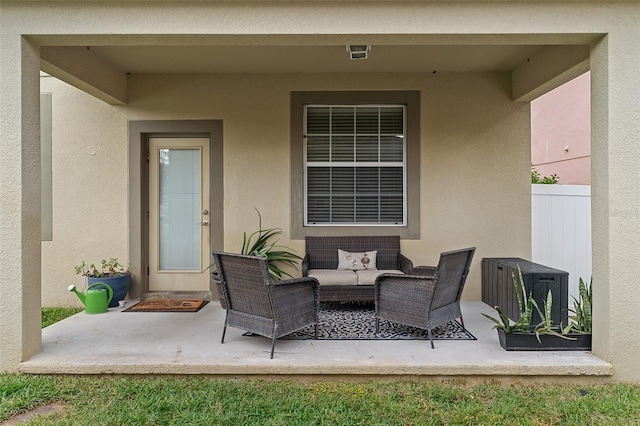 view of patio / terrace with fence and an outdoor living space