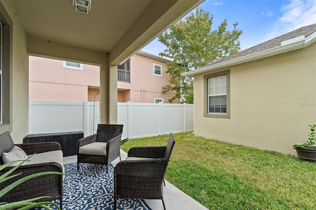 view of patio featuring fence