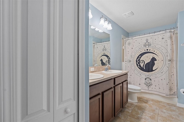 full bathroom with a textured ceiling, curtained shower, toilet, a sink, and double vanity