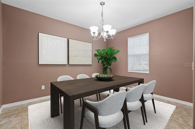 dining area featuring a chandelier