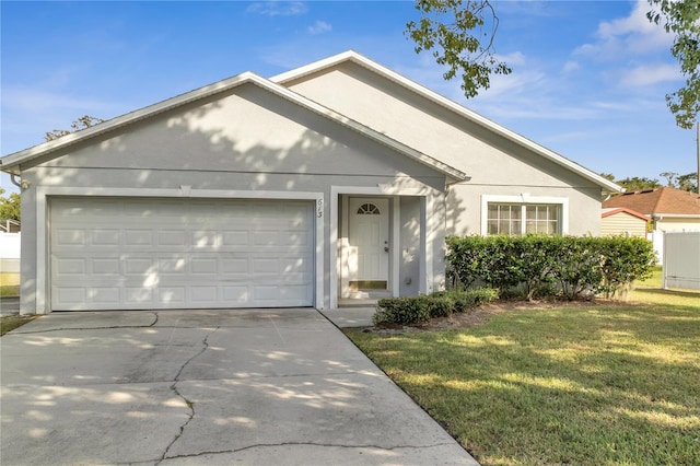 ranch-style home with a garage and a front yard