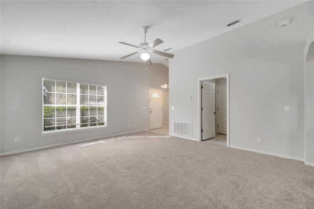 carpeted empty room featuring lofted ceiling and ceiling fan