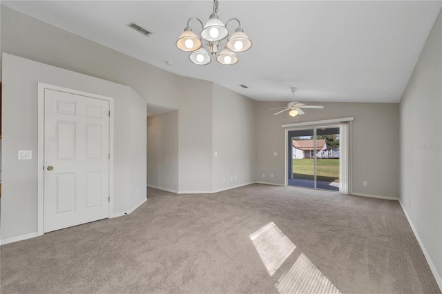 empty room with ceiling fan with notable chandelier, lofted ceiling, and light carpet