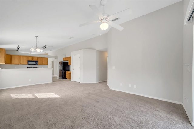 unfurnished living room with light carpet and ceiling fan with notable chandelier