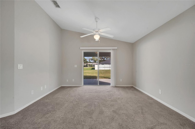 unfurnished room with lofted ceiling, ceiling fan, and carpet floors