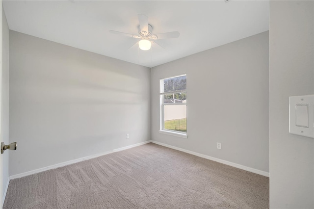 unfurnished room with light carpet and ceiling fan