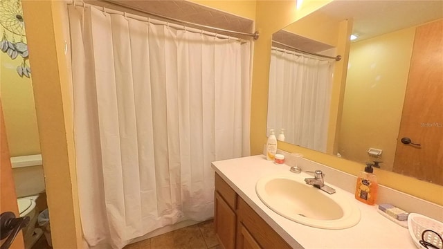 bathroom with vanity, tile patterned floors, and walk in shower