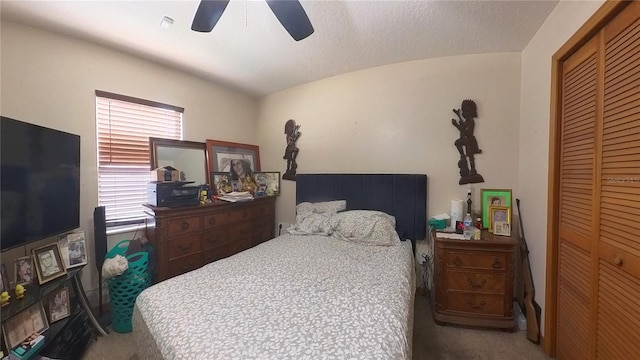 bedroom featuring carpet, a closet, and ceiling fan