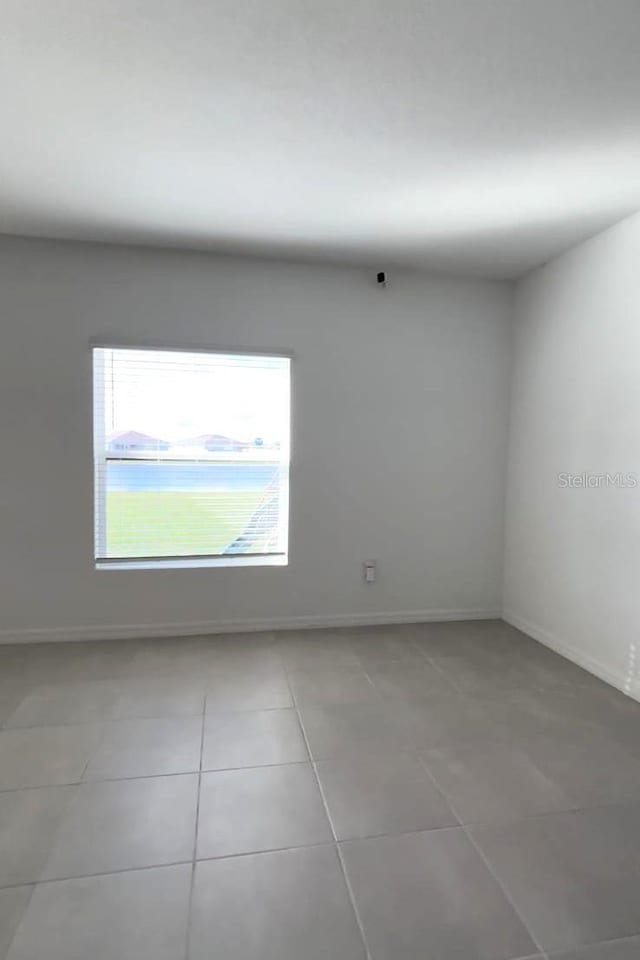 view of tiled spare room