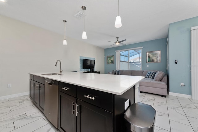 kitchen with sink, dishwasher, an island with sink, ceiling fan, and decorative light fixtures