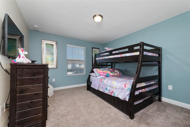 carpeted bedroom with a textured ceiling