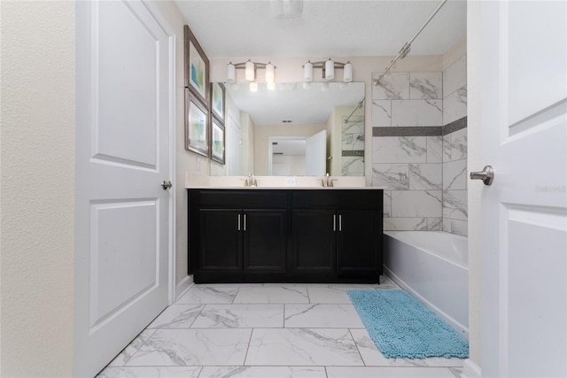 bathroom featuring vanity and tub / shower combination