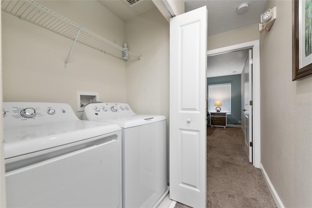 washroom featuring light colored carpet and washing machine and clothes dryer