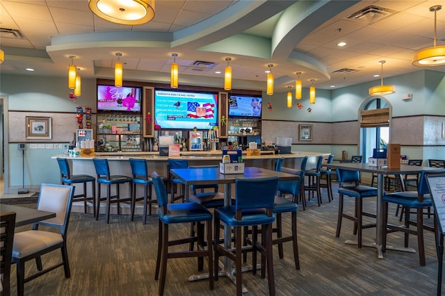 bar with decorative light fixtures