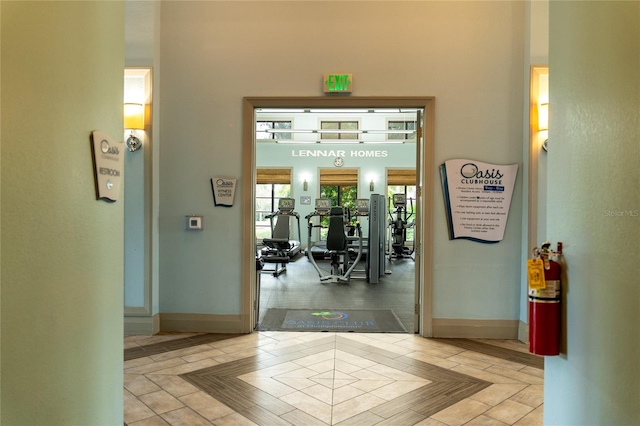 corridor with light hardwood / wood-style flooring