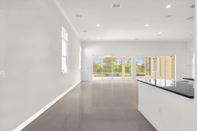 hallway featuring crown molding and tile patterned flooring