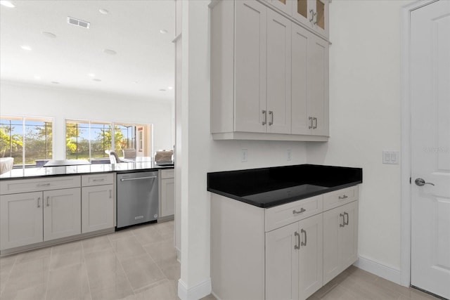 kitchen with dishwasher and white cabinetry