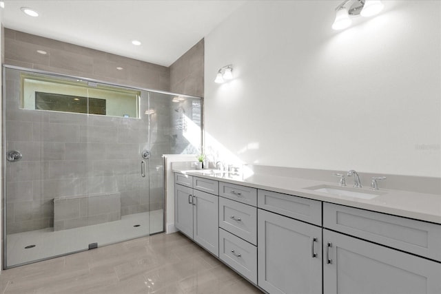 bathroom with vanity and walk in shower