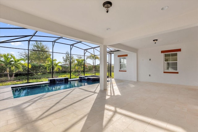 view of pool featuring an in ground hot tub, a patio, a lanai, and pool water feature