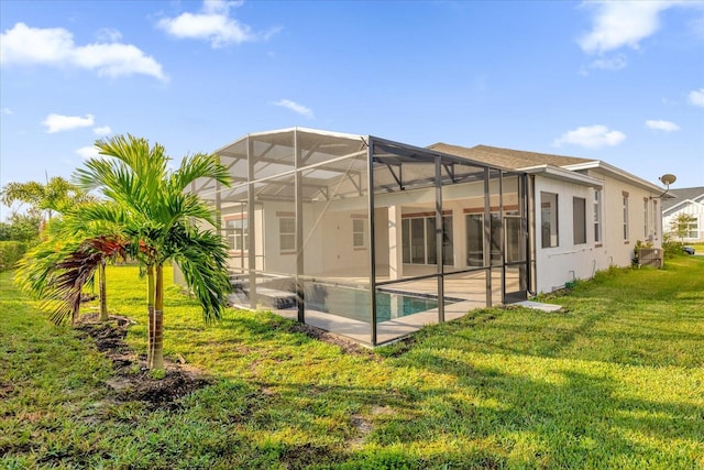 back of property featuring a patio, a lawn, and glass enclosure