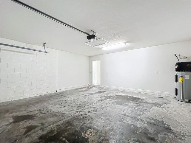 garage featuring a garage door opener and electric water heater