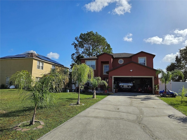 view of front facade with a front yard and a garage