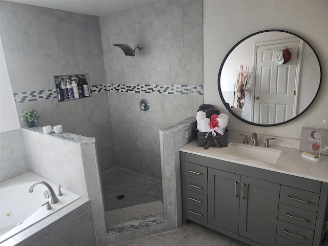 bathroom with separate shower and tub, vanity, and tile patterned flooring