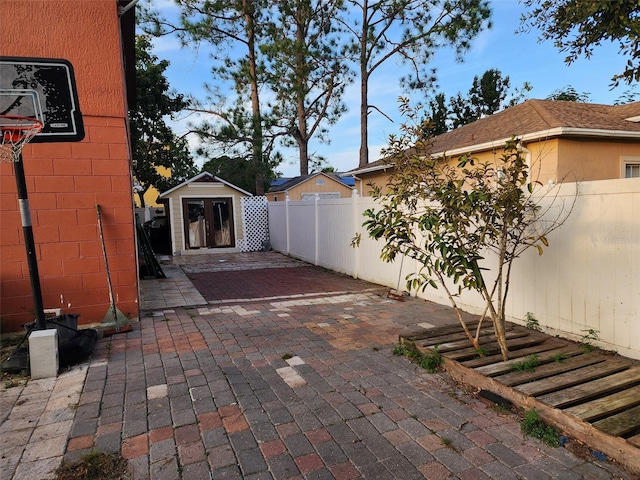 view of patio with an outbuilding