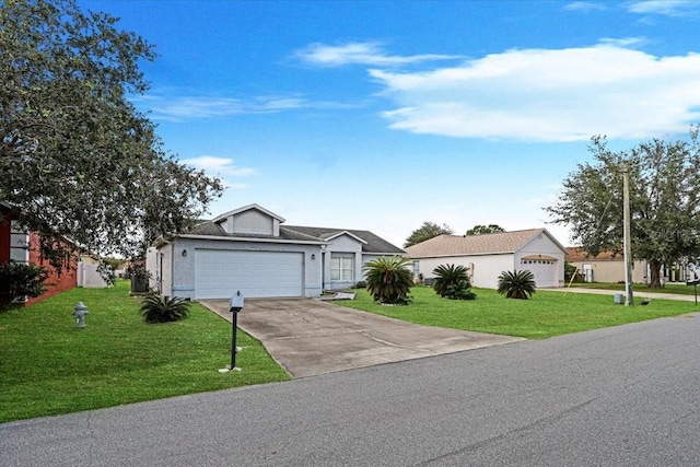 single story home with a garage and a front lawn