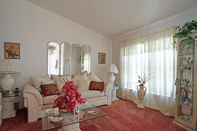 living room with lofted ceiling and carpet floors