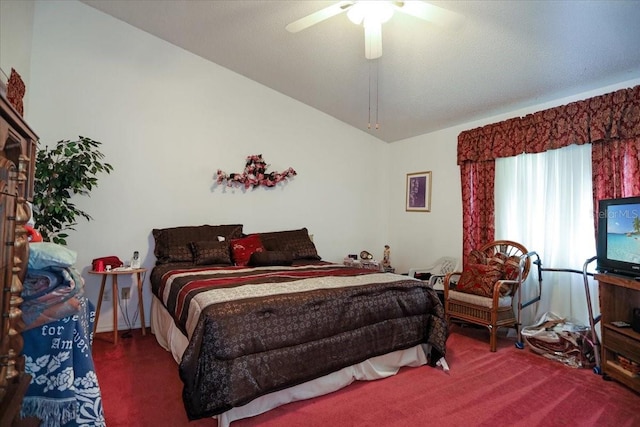 bedroom with vaulted ceiling, ceiling fan, and carpet